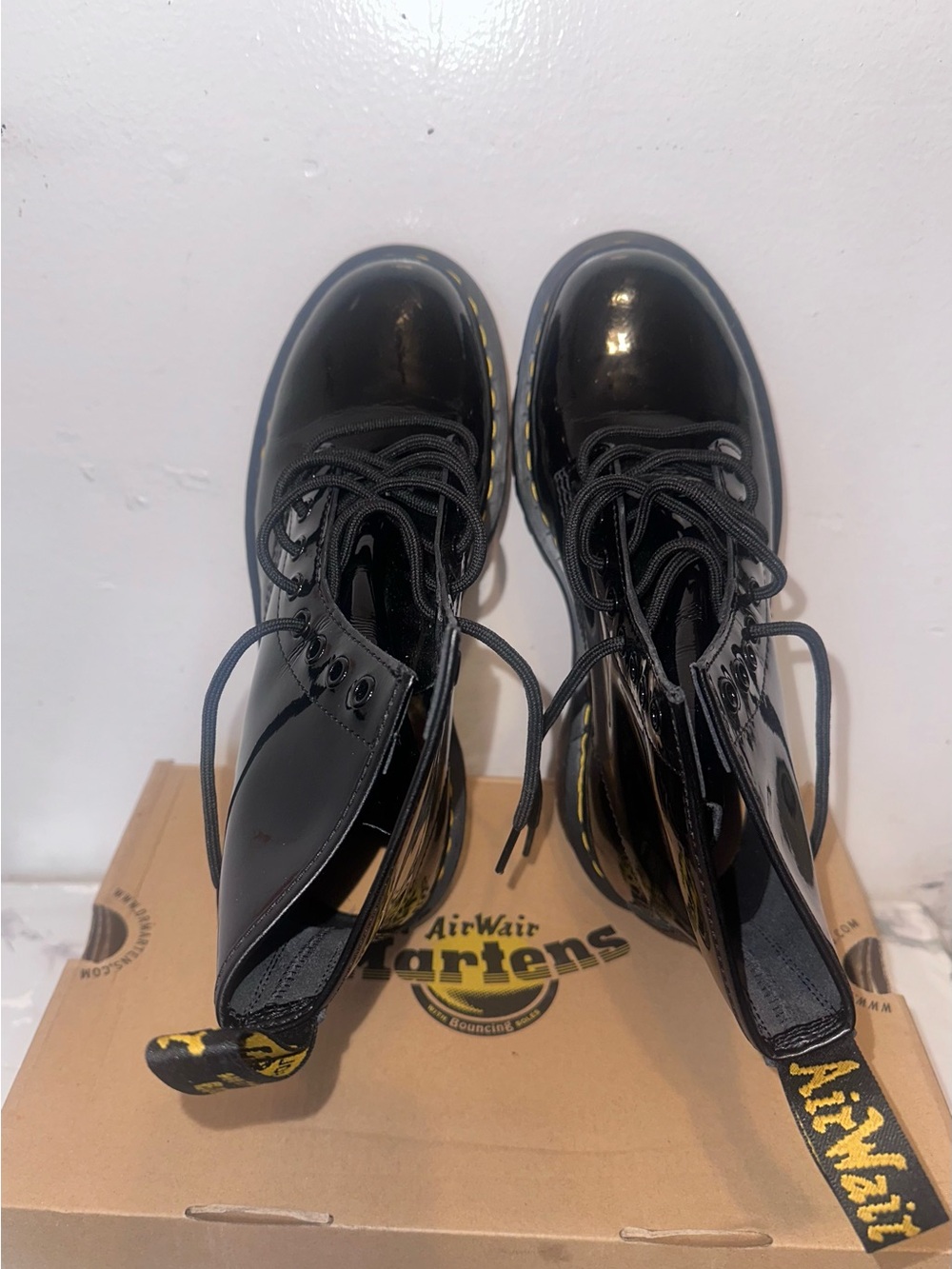 Dr. Martens Black Patent Leather 8-Eye Lace-Up Boots with Yellow Stitching